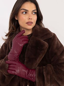 Rukavice AT  Elegantné dámske rukavice z teplej látky v kombinácii s ekologickou kožou. Na zápästiach ozdobné gombíky. Ukazovák s vyšívaným 