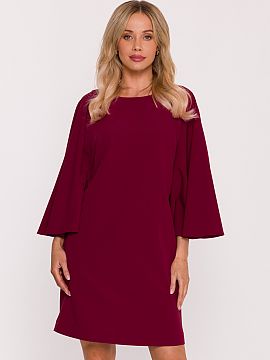 Šaty na deň Stylove  Elegantný šaty v štýle trapezu, vyrobené z hladkej, príjemnej na dotyk látky. Model sa vyznačuje efektnými, širokými rukávmi typ