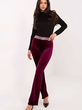 dámske nohavice Italy Moda  Flausové zvonové nohavice sú štýlovým návrhom pre ženy, ktoré milujú kombináciu elegancie a výrazného charakteru. Mäkký, prí