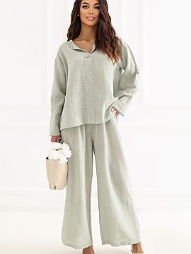 dámske nohavice Italy Moda  Štýlové dámske nohavice s širokými nohavicami, ktoré kombinujú pohodlie s moderným, voľným štýlom. Model má široké nohavice,