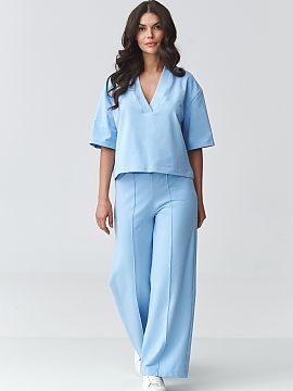 nastaviť Makadamia  Štýlový dámsky set s širokými nohavicami je ideálne spojenie pohodlia a modernnej elegancie. Súprava pozostáva z voľnej blúzky s 