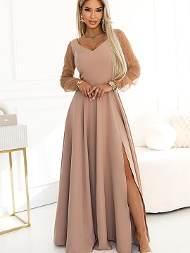 dlhé šaty Numoco  Spoznajte šaty Loretta, ktoré robia dojem ešte pred prvým zvukom. Teplý, šľachtý odtieň béžovej obklopuje postavu pokojom a elega